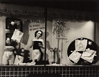 (WINDOW DISPLAYS) A group of 16 photographs of posed, fashionably dressed mannequins, some with seasonal decorations.